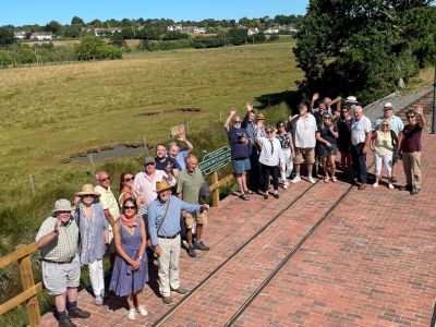 Invitees from East Devon District Council, Colyford, Seaton & Colyton Councils, Fine Family Foundation and National Lottery Heritage Fund experience a tram ride and the new halt at Seaton Wetlands.