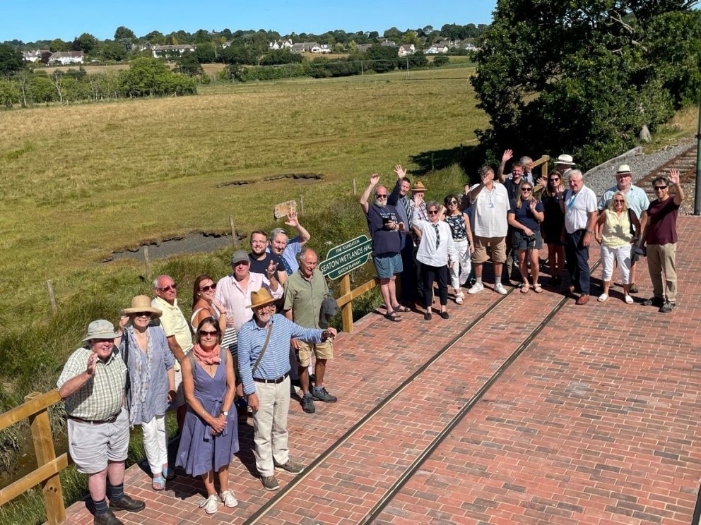 Invitees from East Devon District Council, Colyford, Seaton & Colyton Councils, Fine Family Foundation and National Lottery Heritage Fund experience a tram ride and the new halt at Seaton Wetlands.